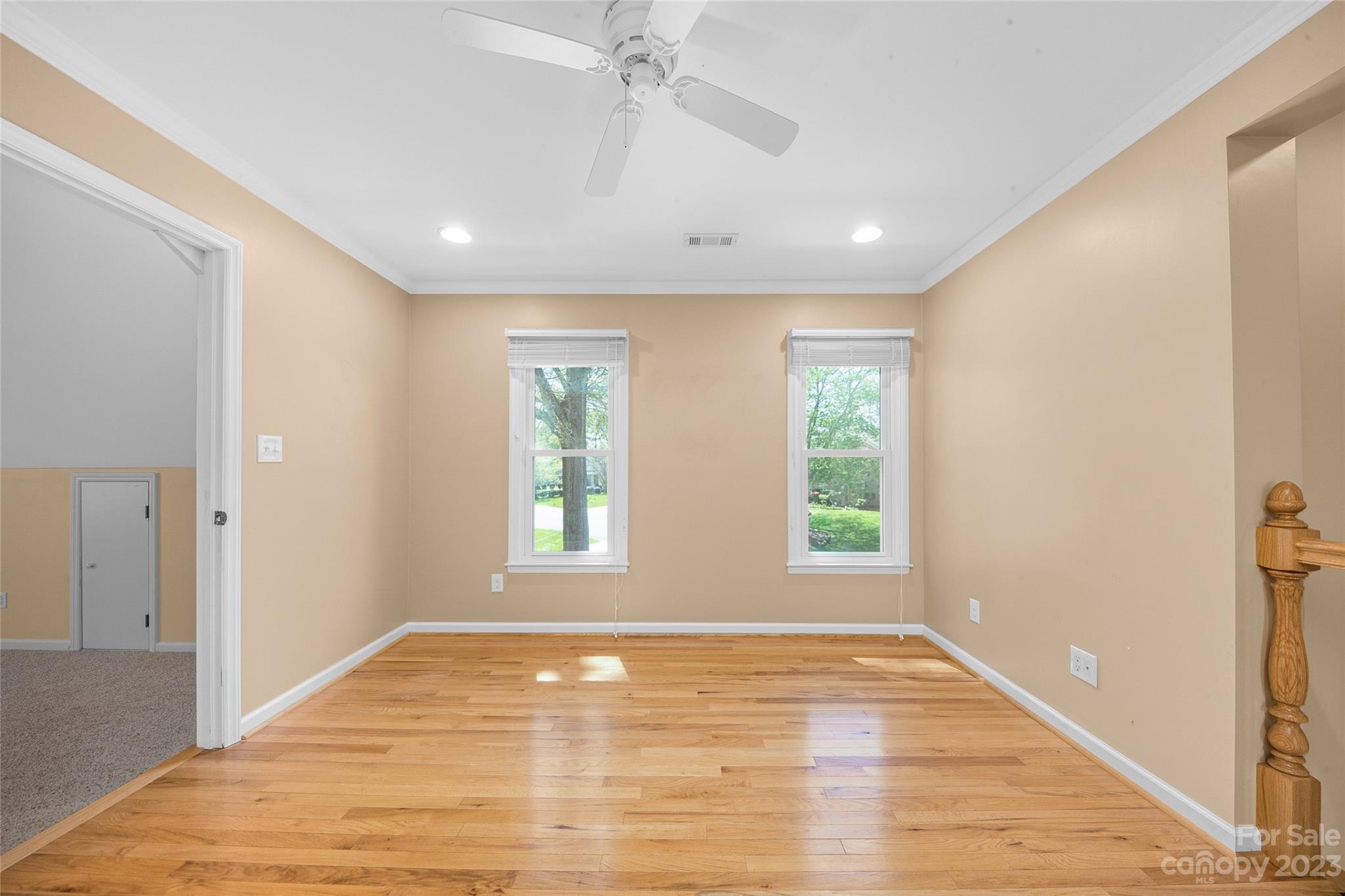 10700 Fairway Ridge Road Charlotte, NC 28277 - Photo 22 of 39 a view of an empty room with wooden floor and a window
