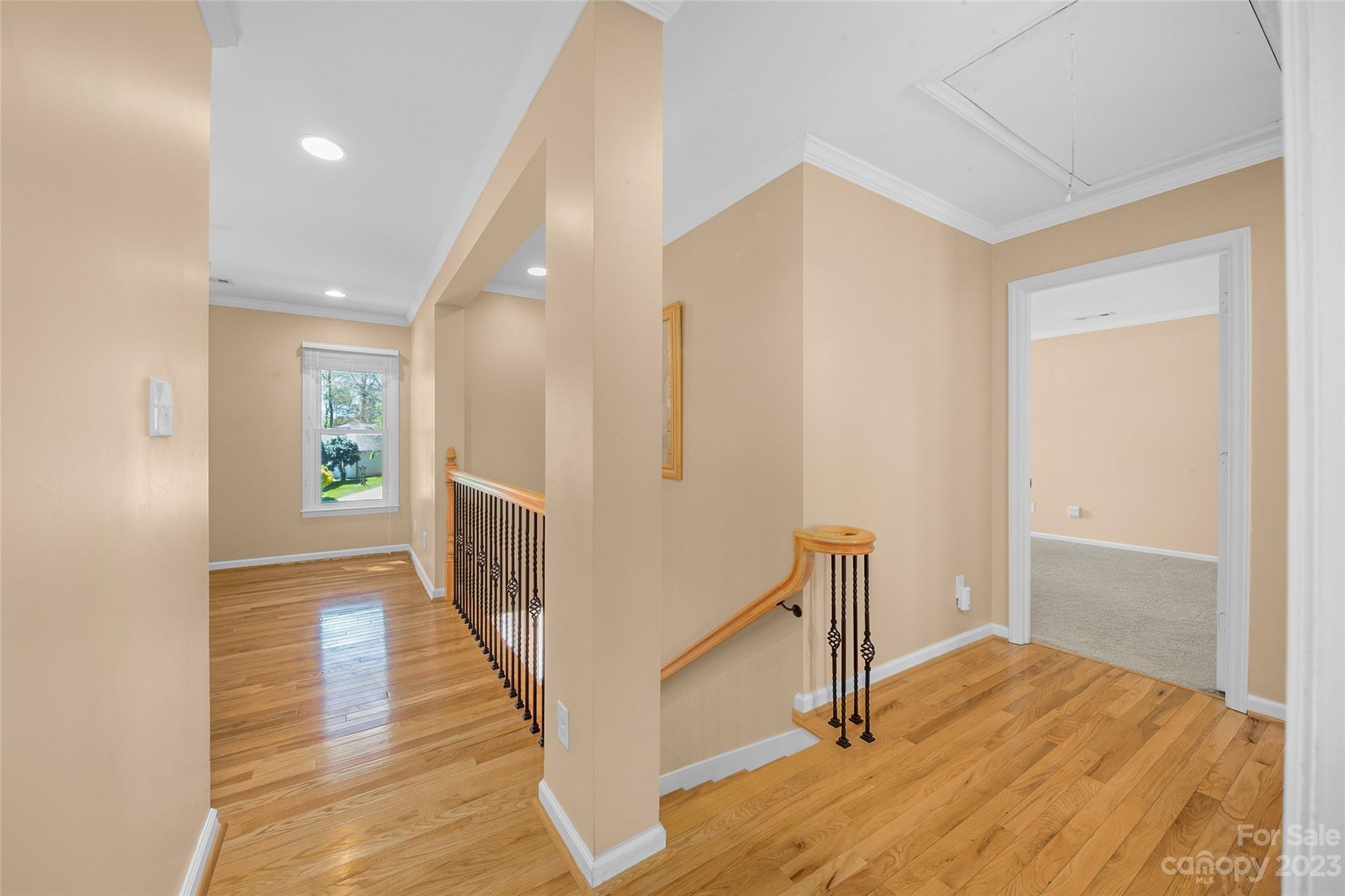 10700 Fairway Ridge Road Charlotte, NC 28277 - Photo 23 of 39 a view of hallway with wooden floor and stairs