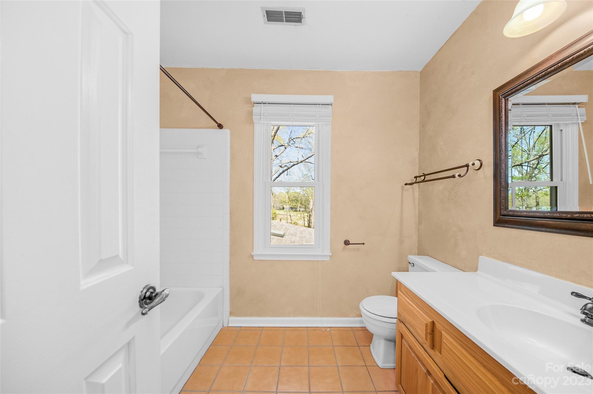 10700 Fairway Ridge Road Charlotte, NC 28277 - Photo 24 of 39 a bathroom with a granite countertop sink a toilet and shower