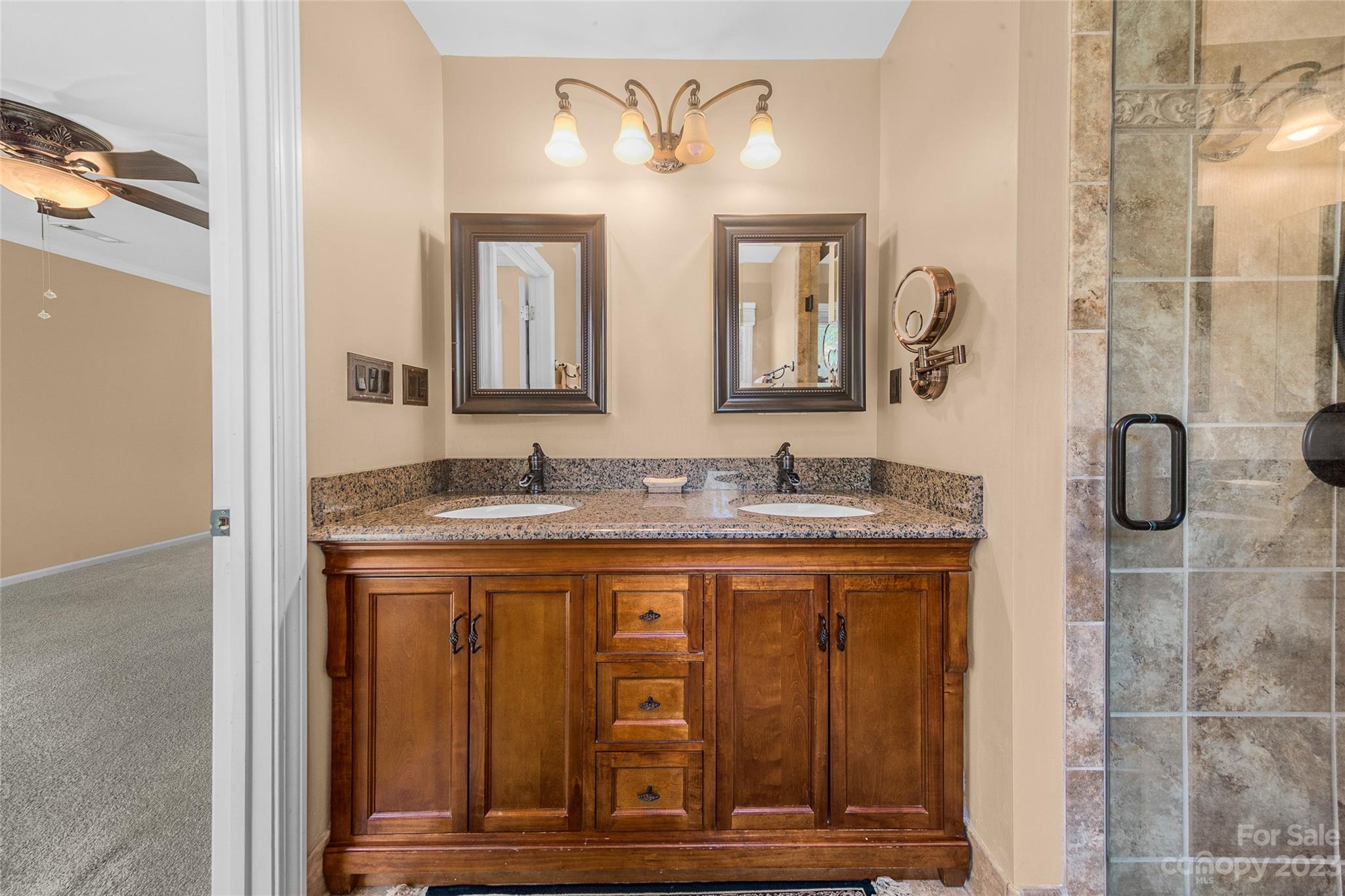 10700 Fairway Ridge Road Charlotte, NC 28277 - Photo 28 of 39 a bathroom with a granite countertop sink and a mirror