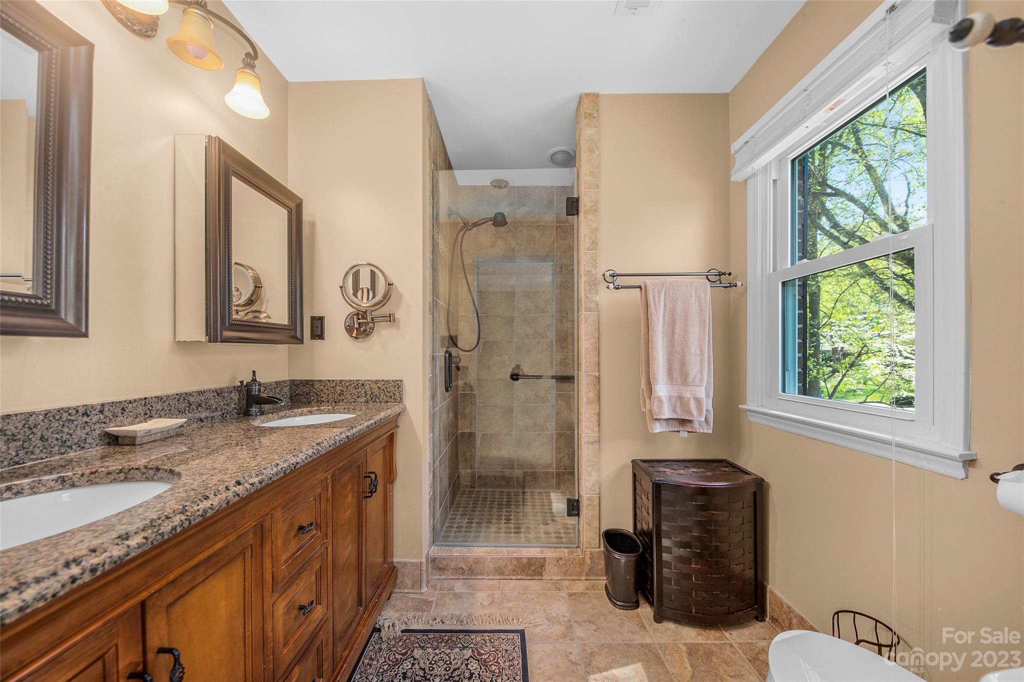 10700 Fairway Ridge Road Charlotte, NC 28277 - Photo 29 of 39 a spacious bathroom with sinks granite countertop tub shower and a mirror