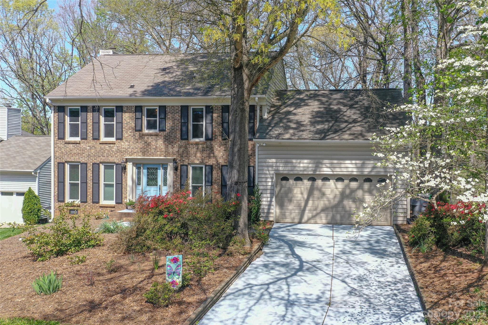 10700 Fairway Ridge Road Charlotte, NC 28277 - Photo 3 of 39 a front view of a house with garden