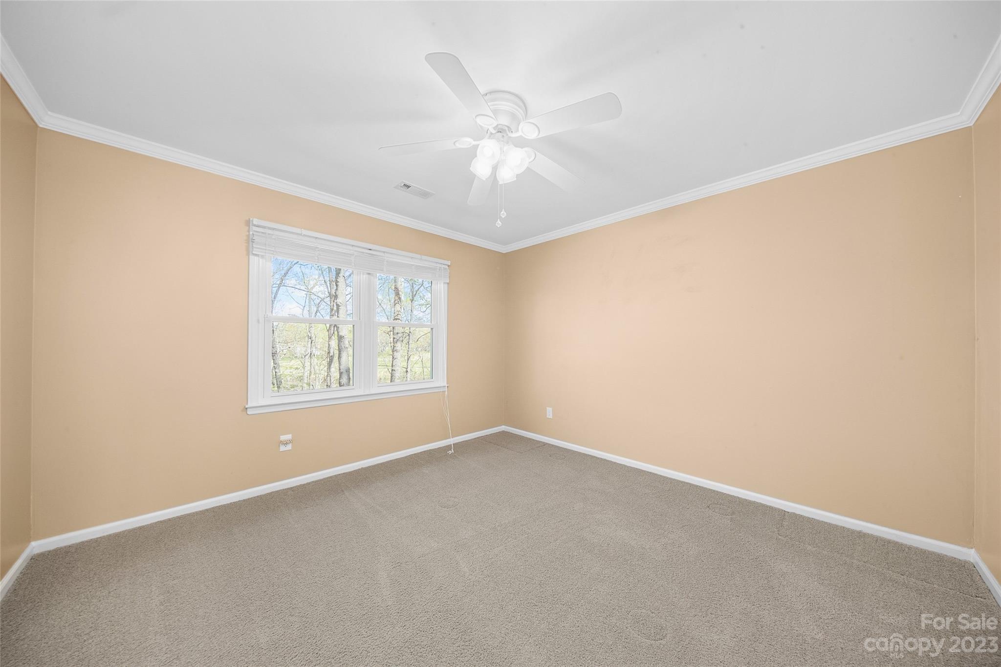 10700 Fairway Ridge Road Charlotte, NC 28277 - Photo 33 of 39 an empty room with a window and a fan