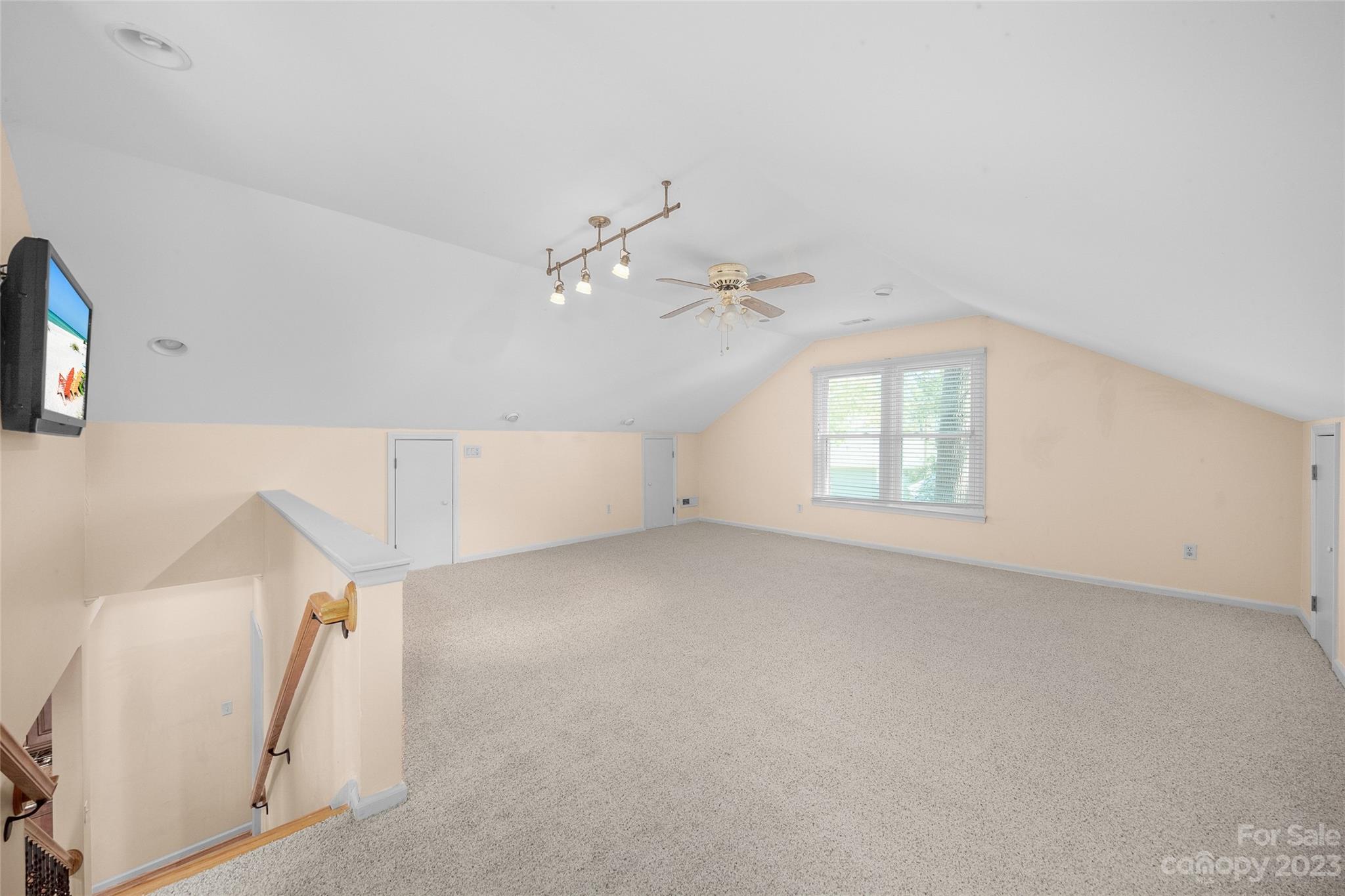 10700 Fairway Ridge Road Charlotte, NC 28277 - Photo 35 of 39 an empty room with windows and ceiling fan