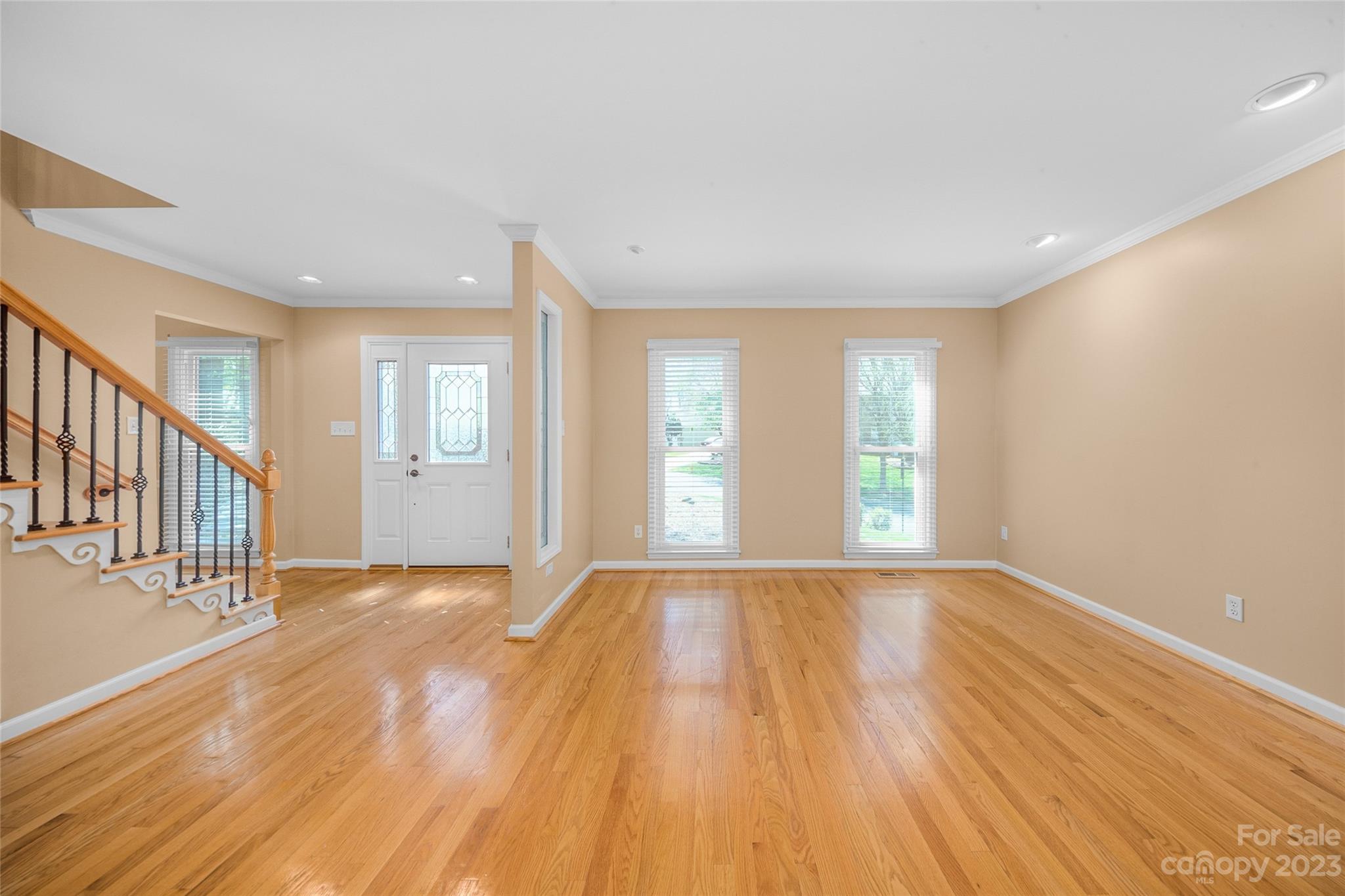 10700 Fairway Ridge Road Charlotte, NC 28277 - Photo 5 of 39 a view of an empty room with wooden floor and a window