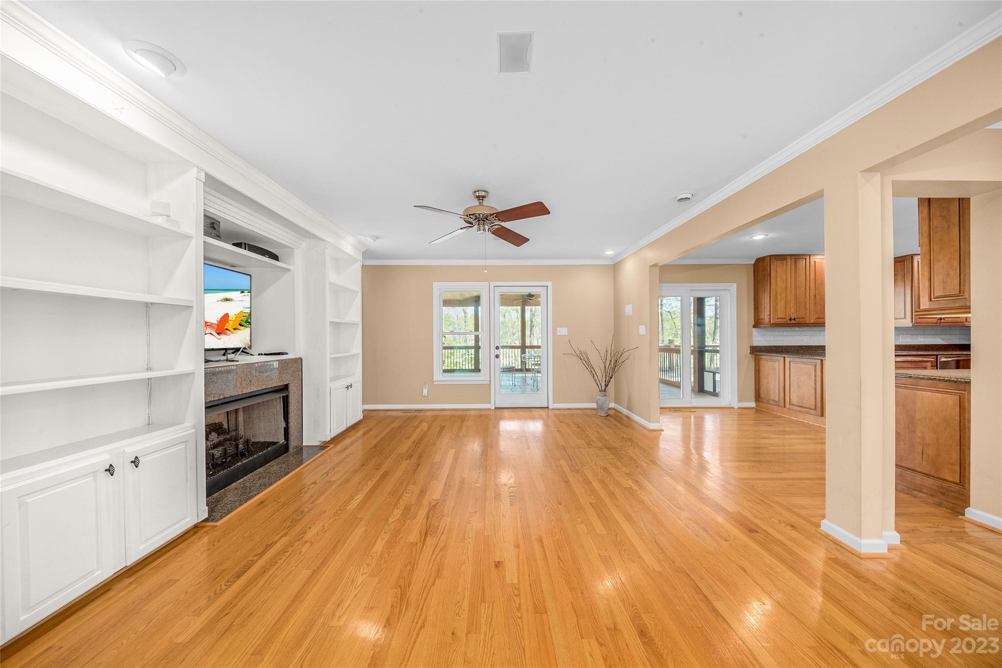 10700 Fairway Ridge Road Charlotte, NC 28277 - Photo 7 of 39 a view of an empty room with a fireplace and a window