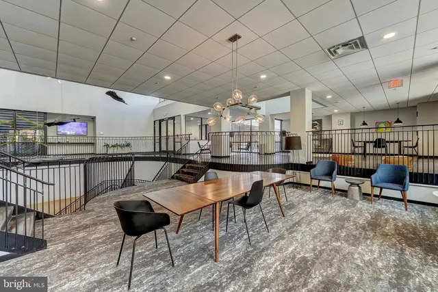 a living room with lots of furniture and a rug