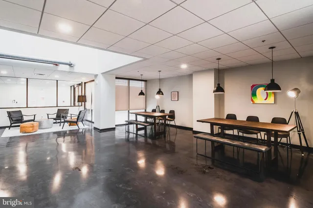 a lobby with furniture and wooden floor