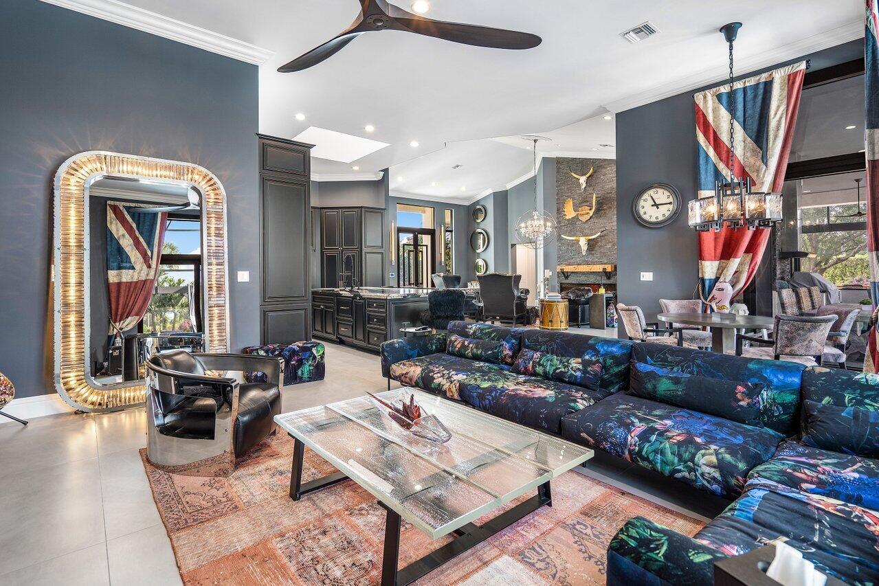 4848 Chamal Circle Boca Raton, FL 33487 - Photo 13 of 88 a living room with furniture and a flat screen tv