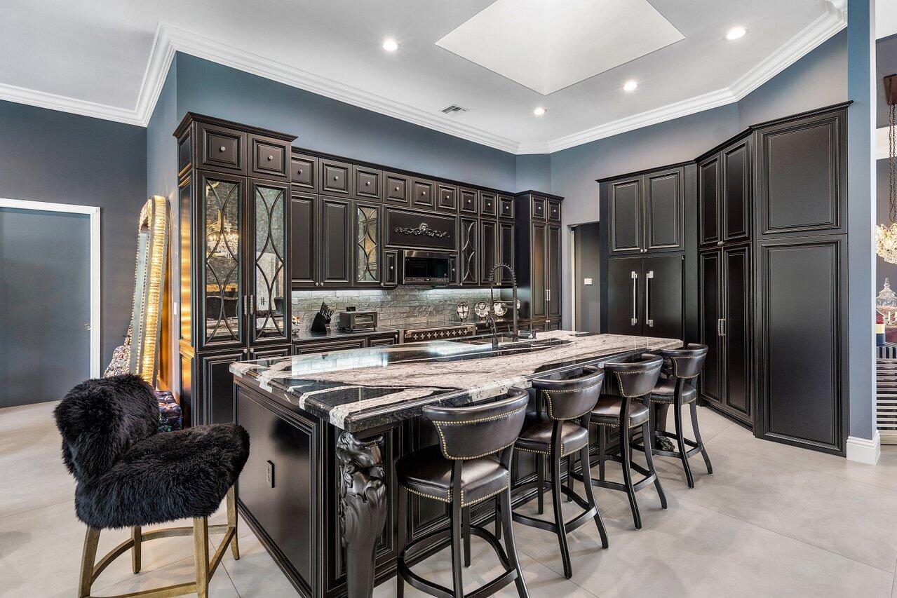 4848 Chamal Circle Boca Raton, FL 33487 - Photo 17 of 88 a kitchen with stainless steel appliances granite countertop a stove a refrigerator and a refrigerator