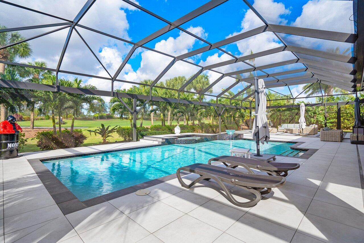4848 Chamal Circle Boca Raton, FL 33487 - Photo 2 of 88 a view of a swimming pool with a patio