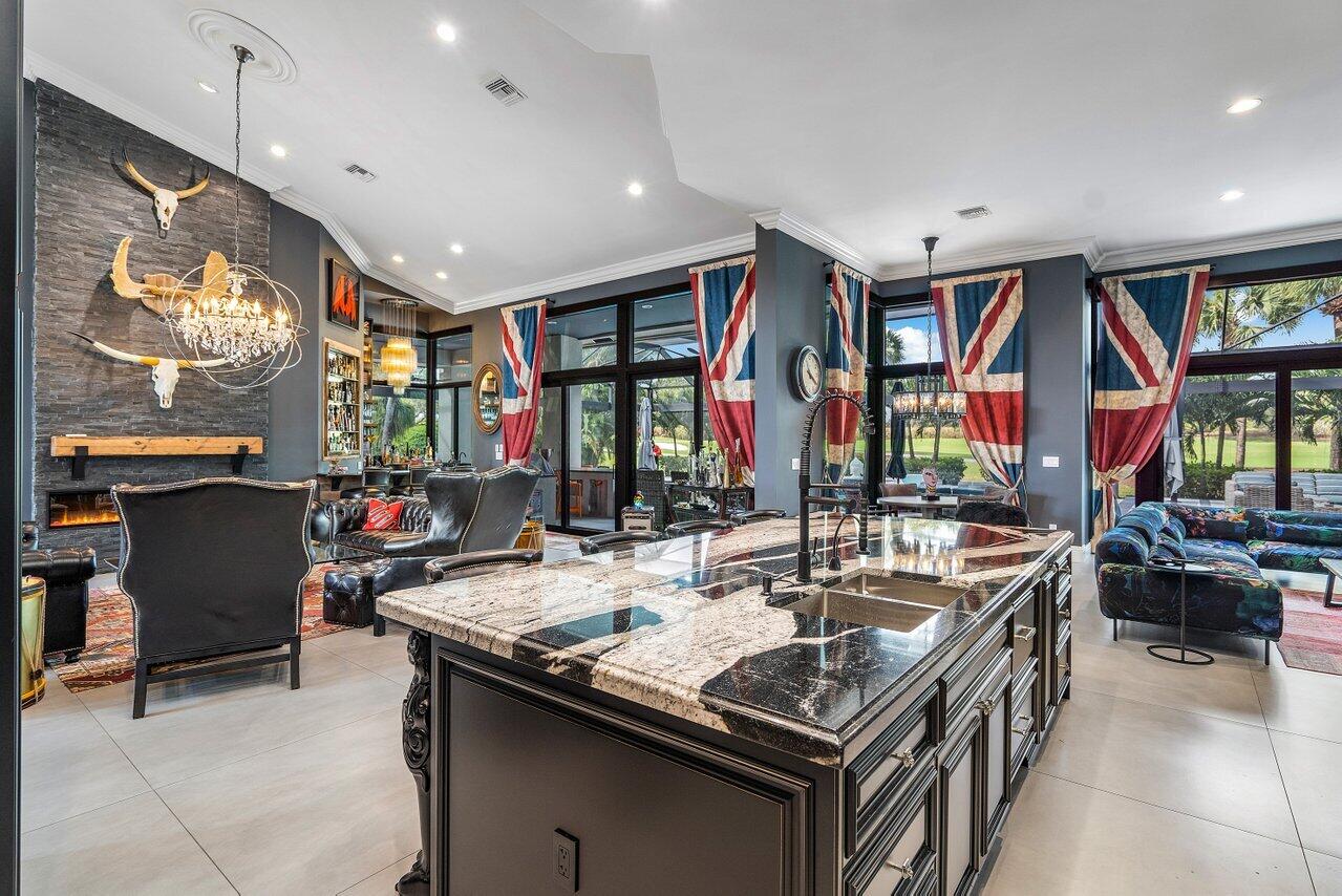 4848 Chamal Circle Boca Raton, FL 33487 - Photo 21 of 88 a kitchen with stainless steel appliances granite countertop a stove and a sink