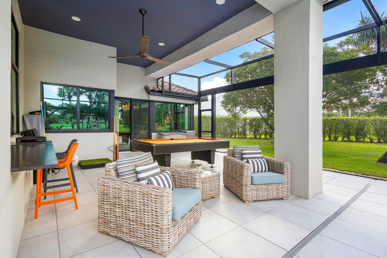 4848 Chamal Circle Boca Raton, FL 33487 - Photo 39 of 88 a outdoor space with patio the couches and pool view