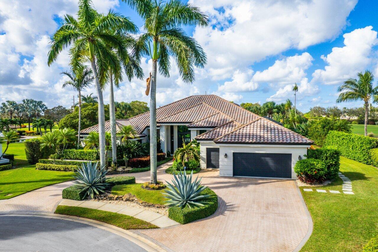 4848 Chamal Circle Boca Raton, FL 33487 - Photo 47 of 88 a front view of a house with garden