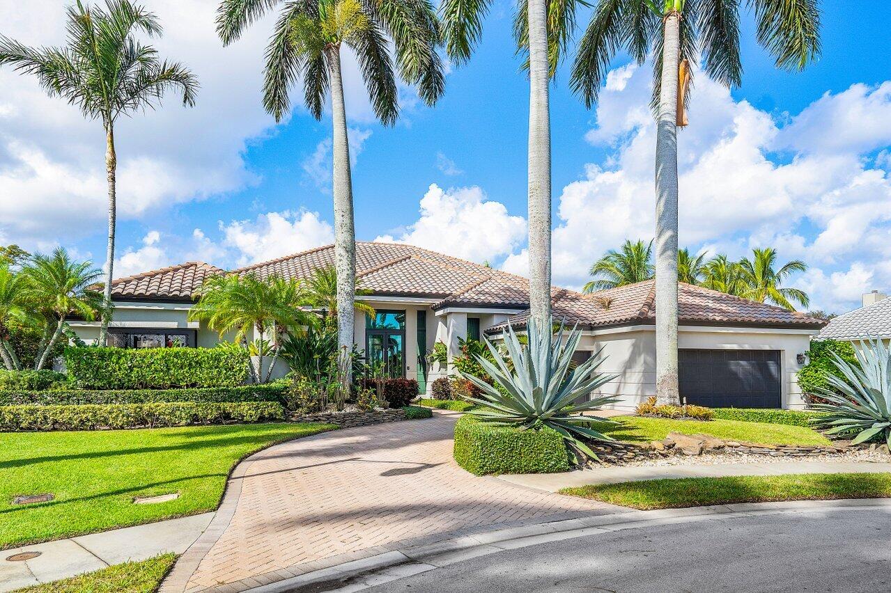 4848 Chamal Circle Boca Raton, FL 33487 - Photo 5 of 88 a view of a house with a yard and potted plants
