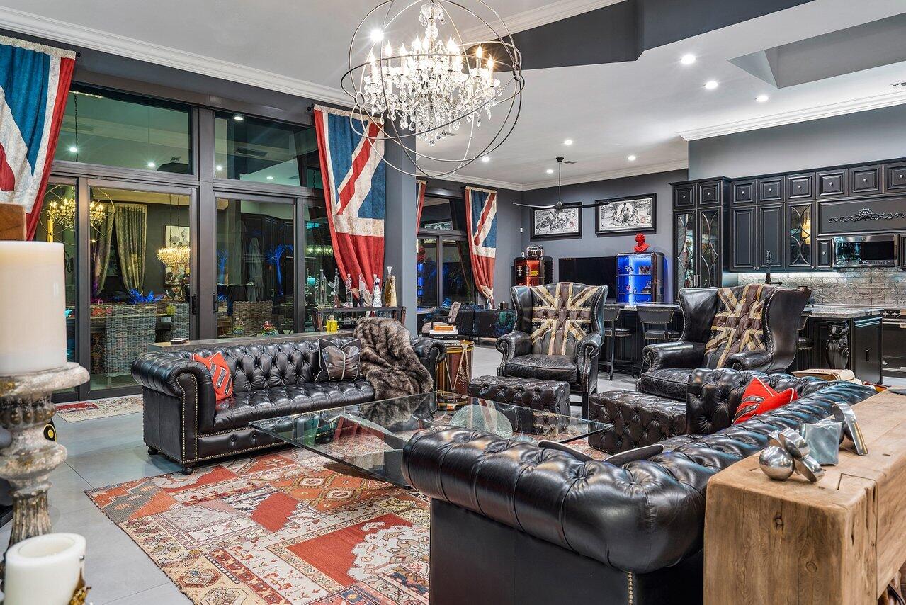 4848 Chamal Circle Boca Raton, FL 33487 - Photo 65 of 88 a living room with lots of furniture and chandelier