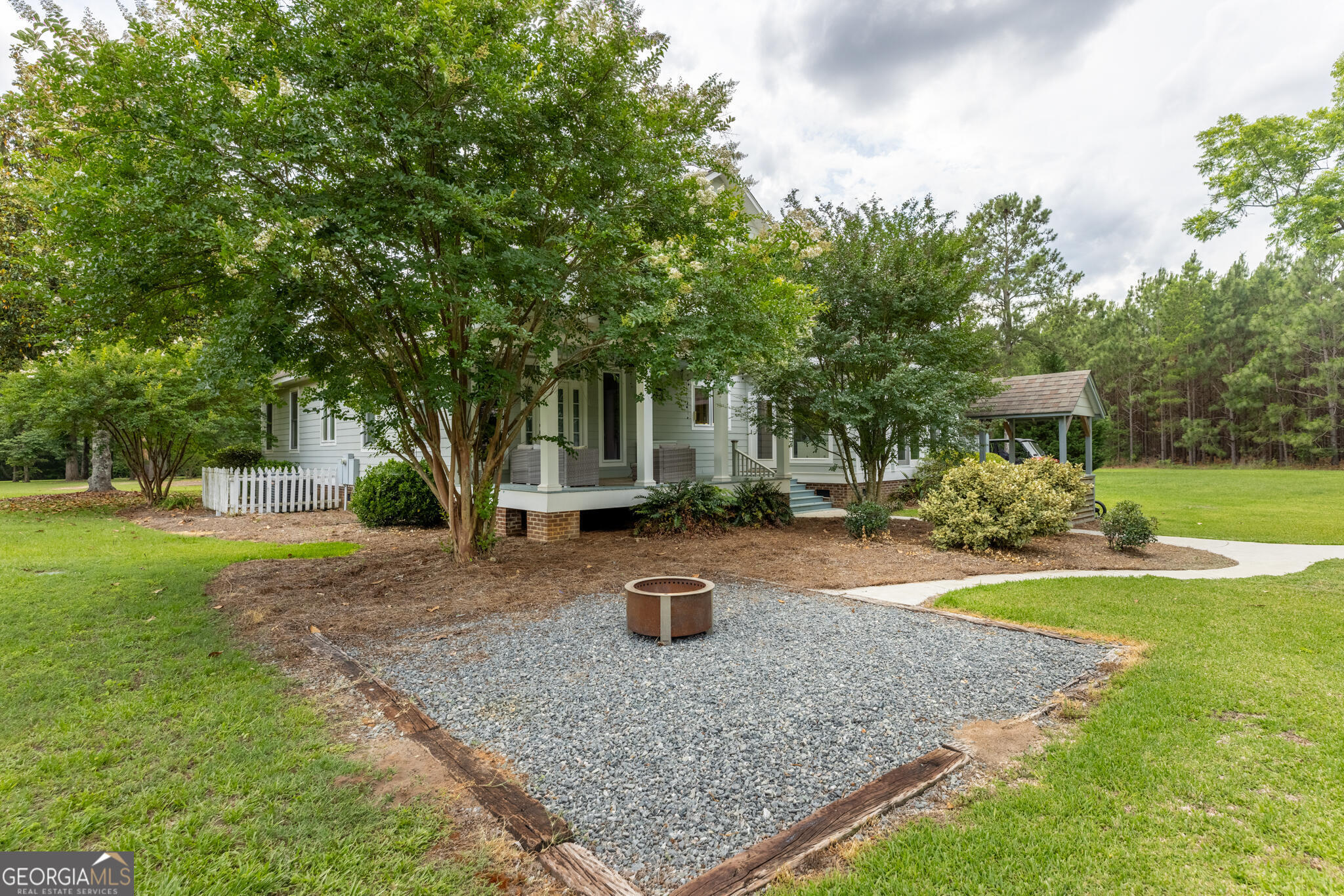 1859 Upper River Road Americus, GA 31709 - Photo 12 of 47 a front view of a house with a yard