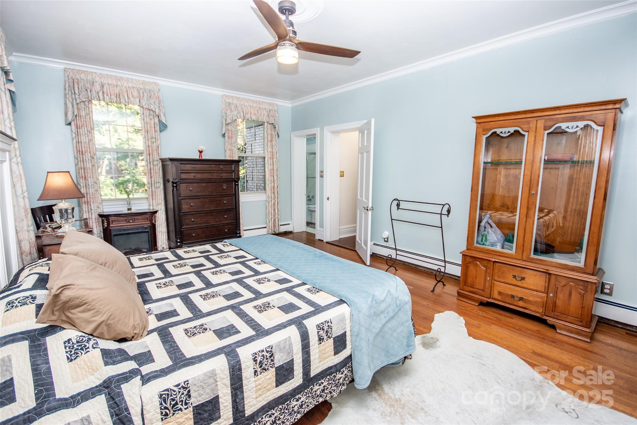 322 Valley Stream Road Statesville, NC 28677 - Photo 23 of 45 a bedroom with a bed and dresser with mirror