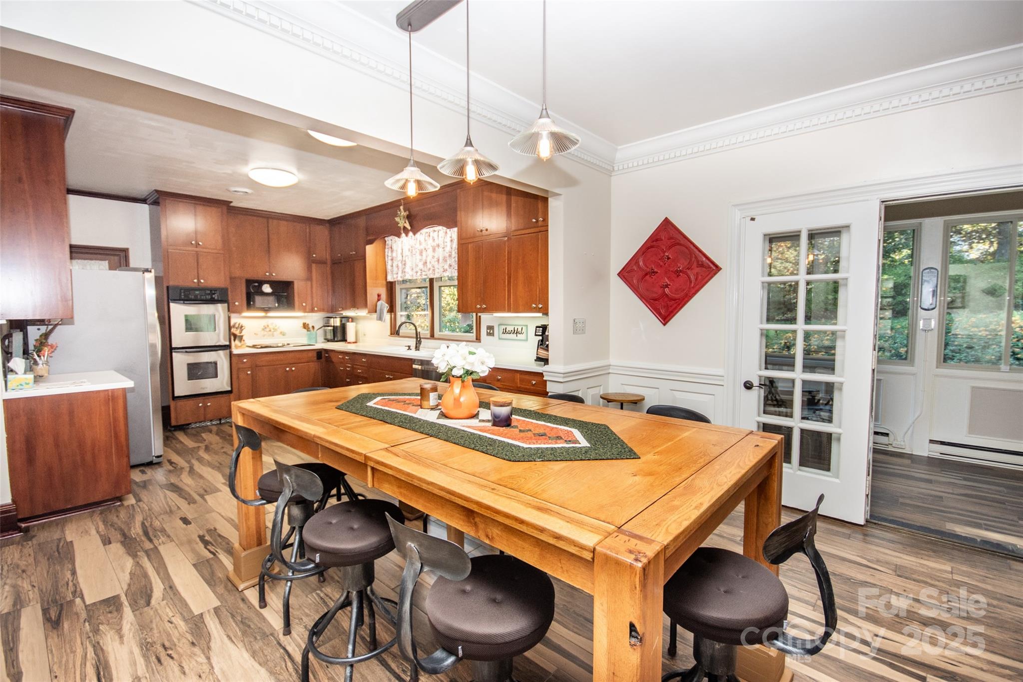322 Valley Stream Road Statesville, NC 28677 - Photo 8 of 45 a dining room with a table chairs and a kitchen view