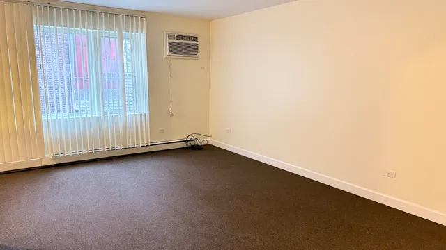 a view of a small space with wooden floor