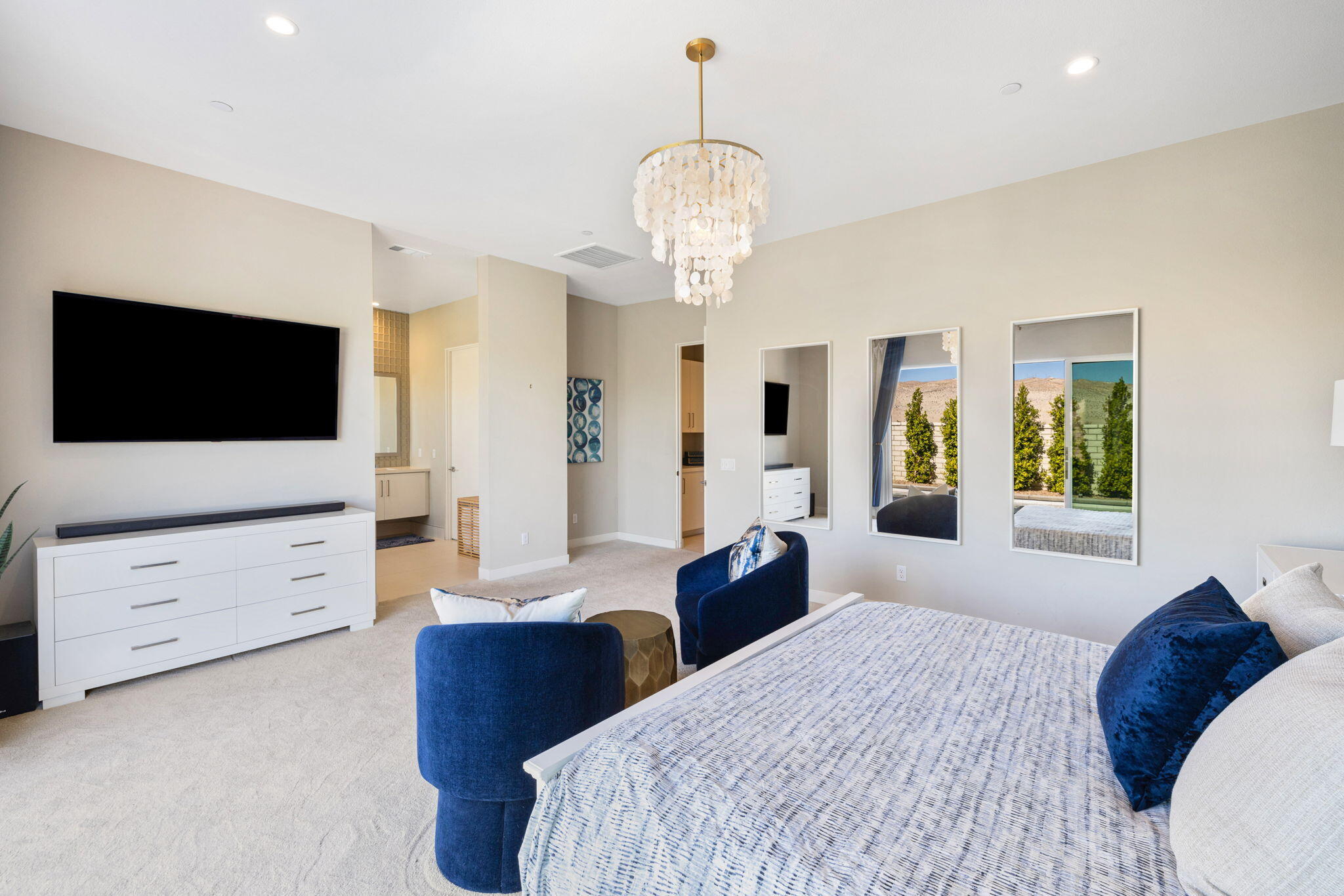 2 Iridium Way Rancho Mirage, CA 92270 - Photo 22 of 67 a spacious bedroom with a bed and a flat screen tv