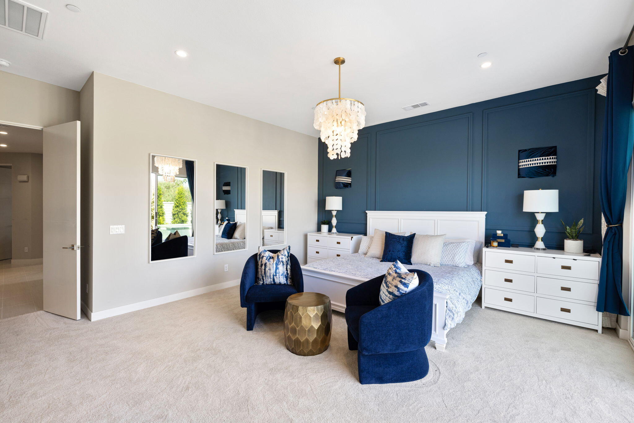 2 Iridium Way Rancho Mirage, CA 92270 - Photo 23 of 67 a bed room with bed and a chandelier