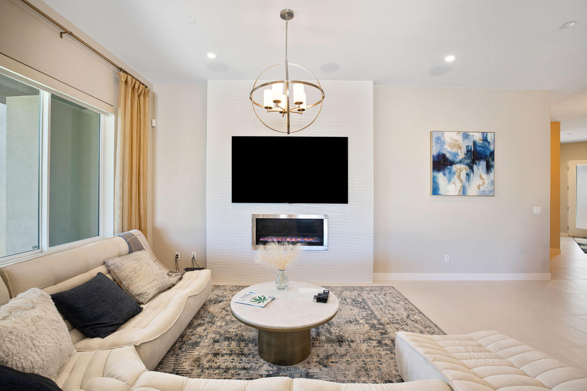 2 Iridium Way Rancho Mirage, CA 92270 - Photo 26 of 67 a living room with furniture and a flat screen tv