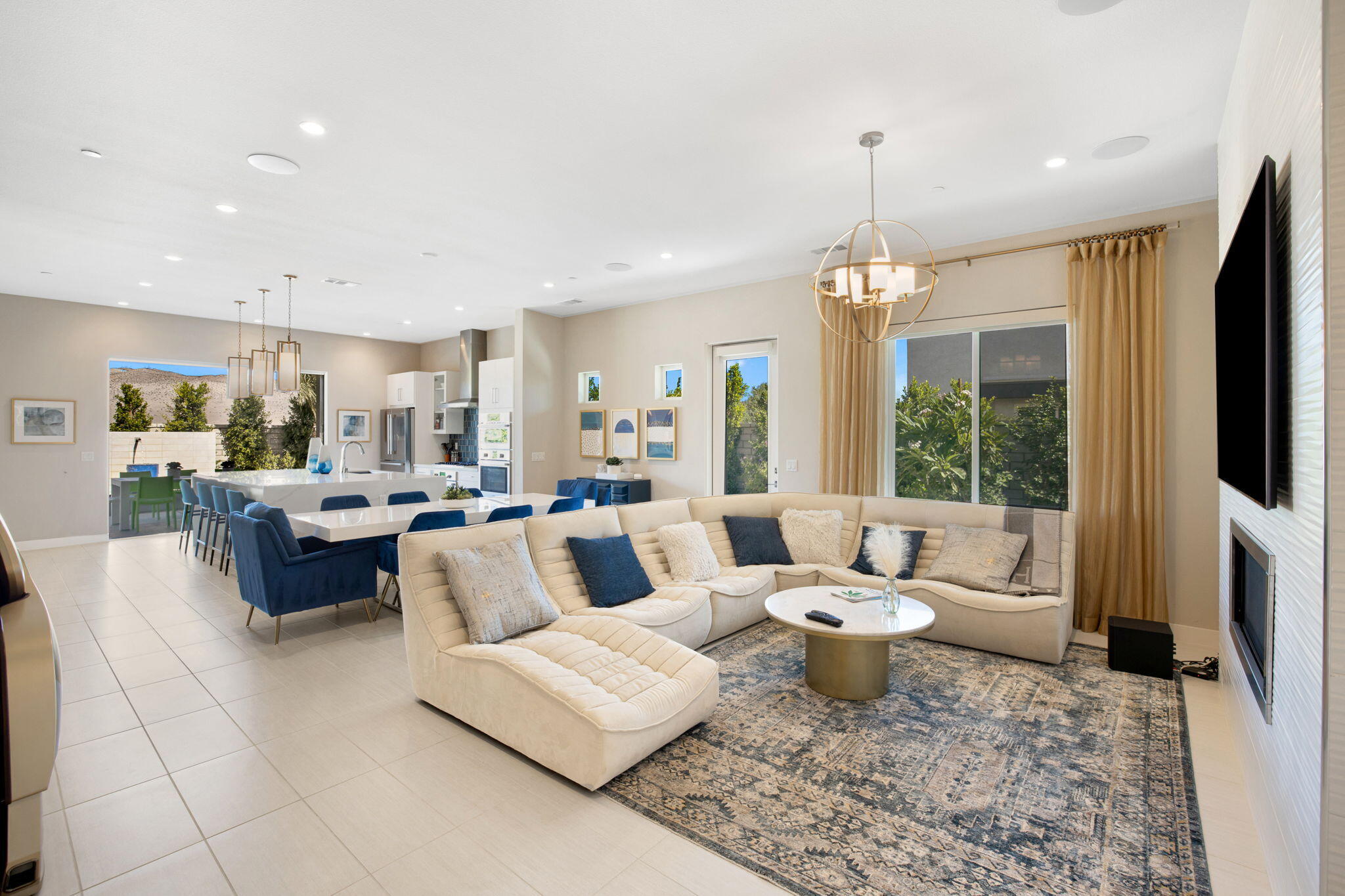 2 Iridium Way Rancho Mirage, CA 92270 - Photo 28 of 67 a living room with furniture and a flat screen tv