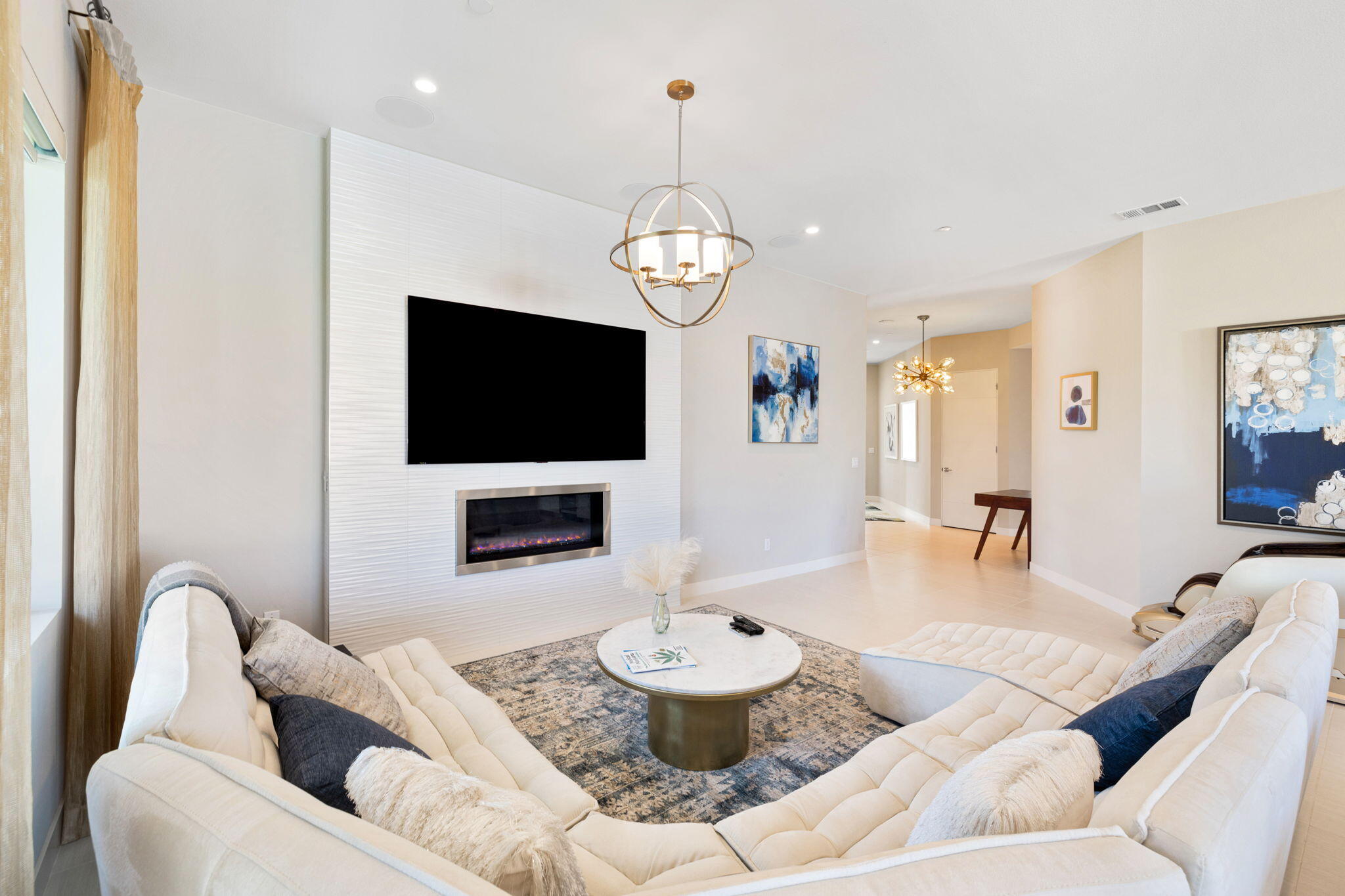 2 Iridium Way Rancho Mirage, CA 92270 - Photo 29 of 67 a living room with furniture and a flat screen tv