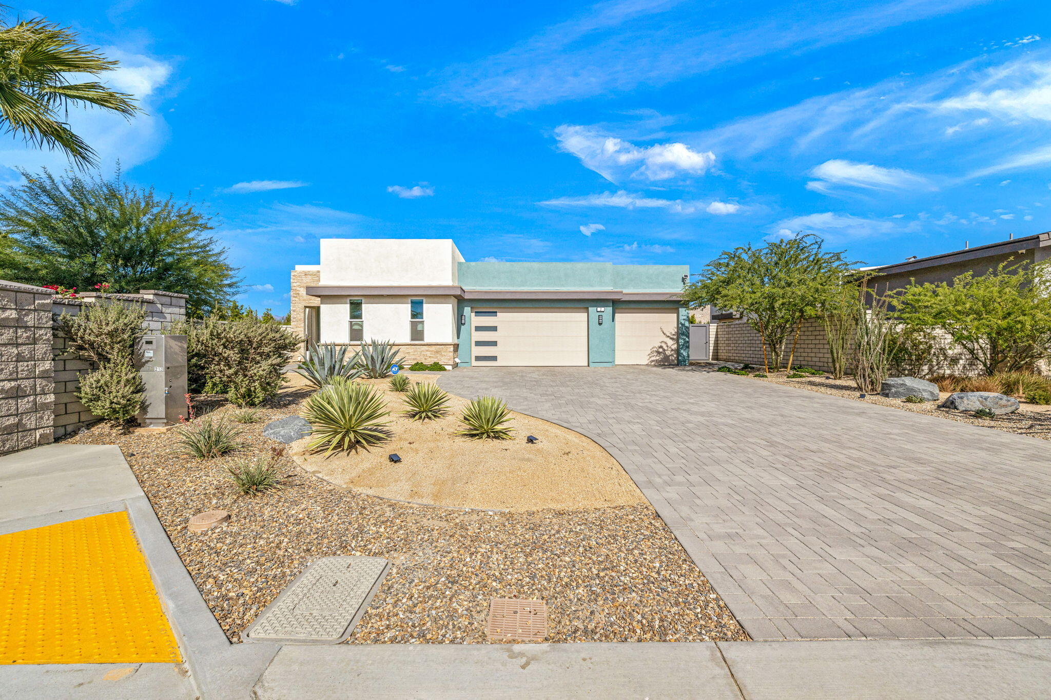 2 Iridium Way Rancho Mirage, CA 92270 - Photo 3 of 67 a view of a swimming pool with a patio