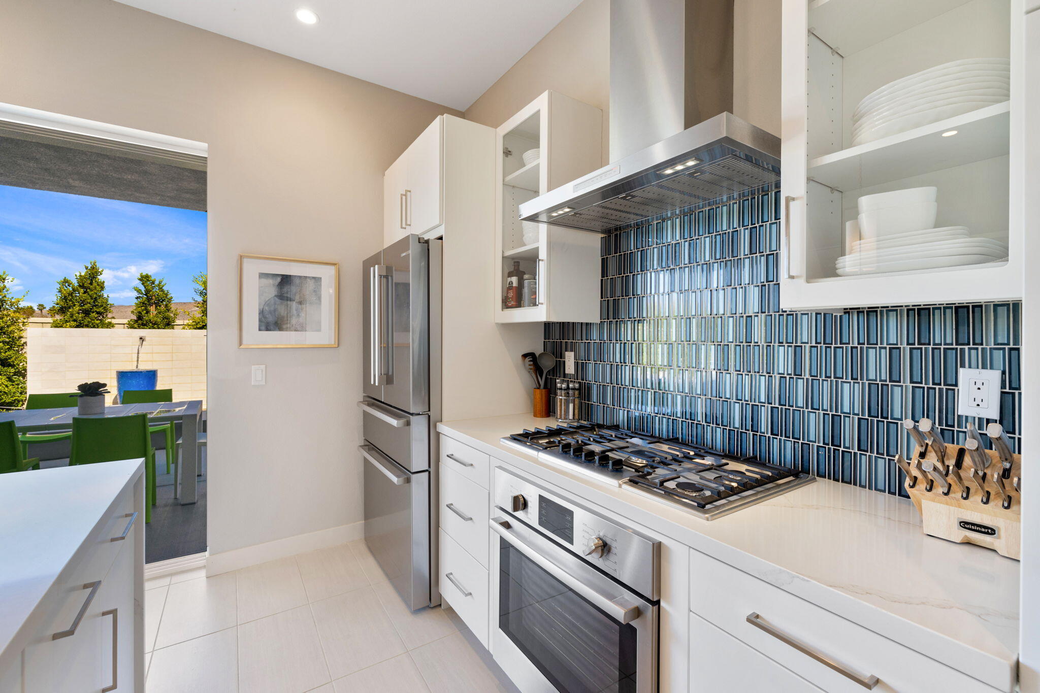 2 Iridium Way Rancho Mirage, CA 92270 - Photo 32 of 67 a kitchen with a stove and a refrigerator
