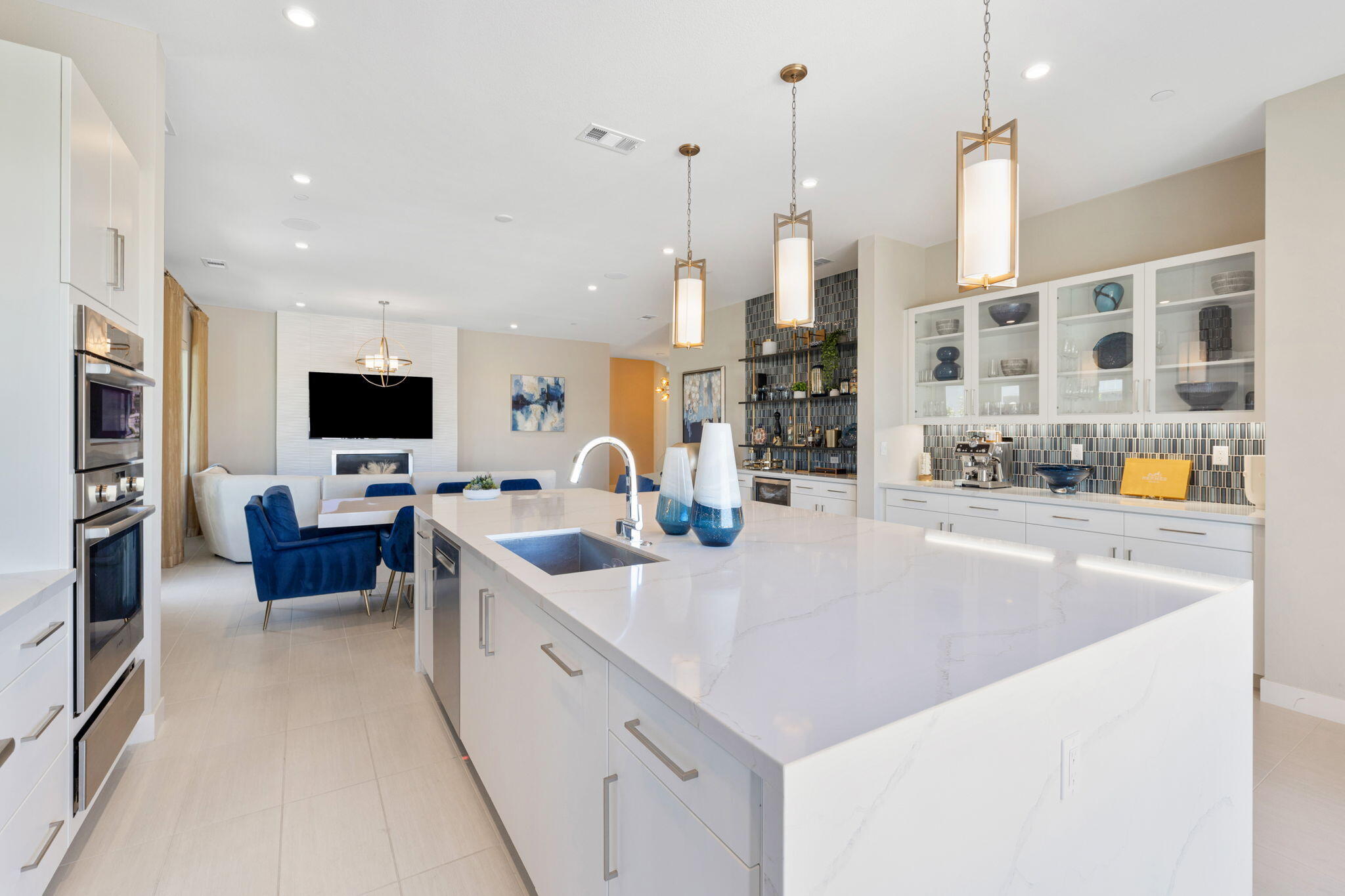 2 Iridium Way Rancho Mirage, CA 92270 - Photo 33 of 67 a large kitchen with stainless steel appliances and a view of living room