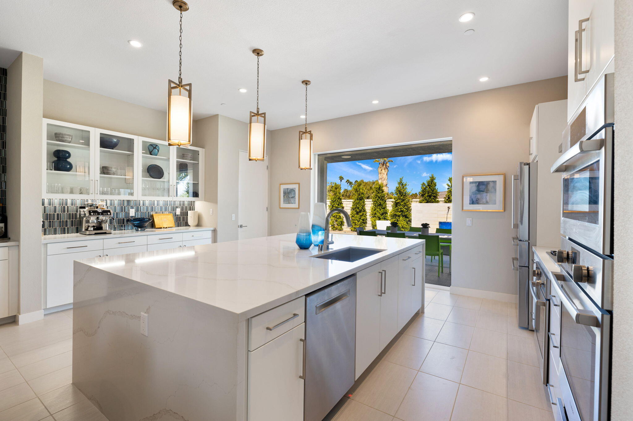 2 Iridium Way Rancho Mirage, CA 92270 - Photo 35 of 67 a kitchen with stainless steel appliances granite countertop a sink and a refrigerator