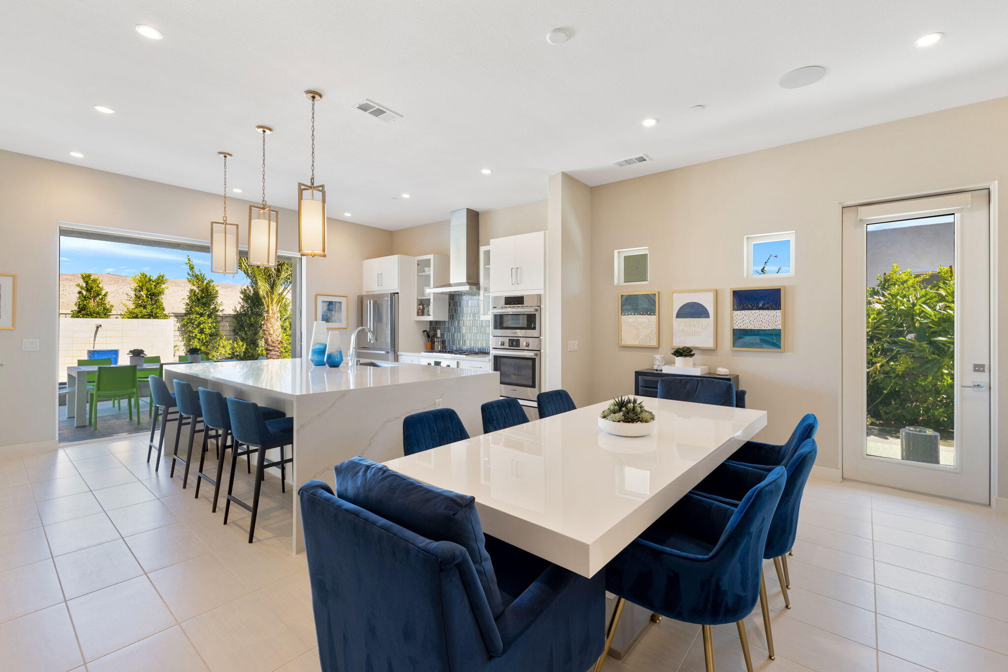 2 Iridium Way Rancho Mirage, CA 92270 - Photo 37 of 67 a dining room with furniture a floor to ceiling kitchen view and a large window