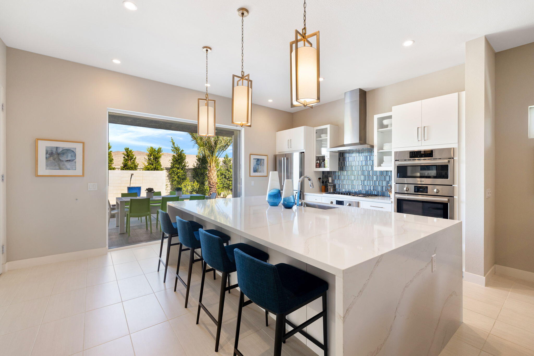 2 Iridium Way Rancho Mirage, CA 92270 - Photo 38 of 67 a large kitchen with a table and chairs