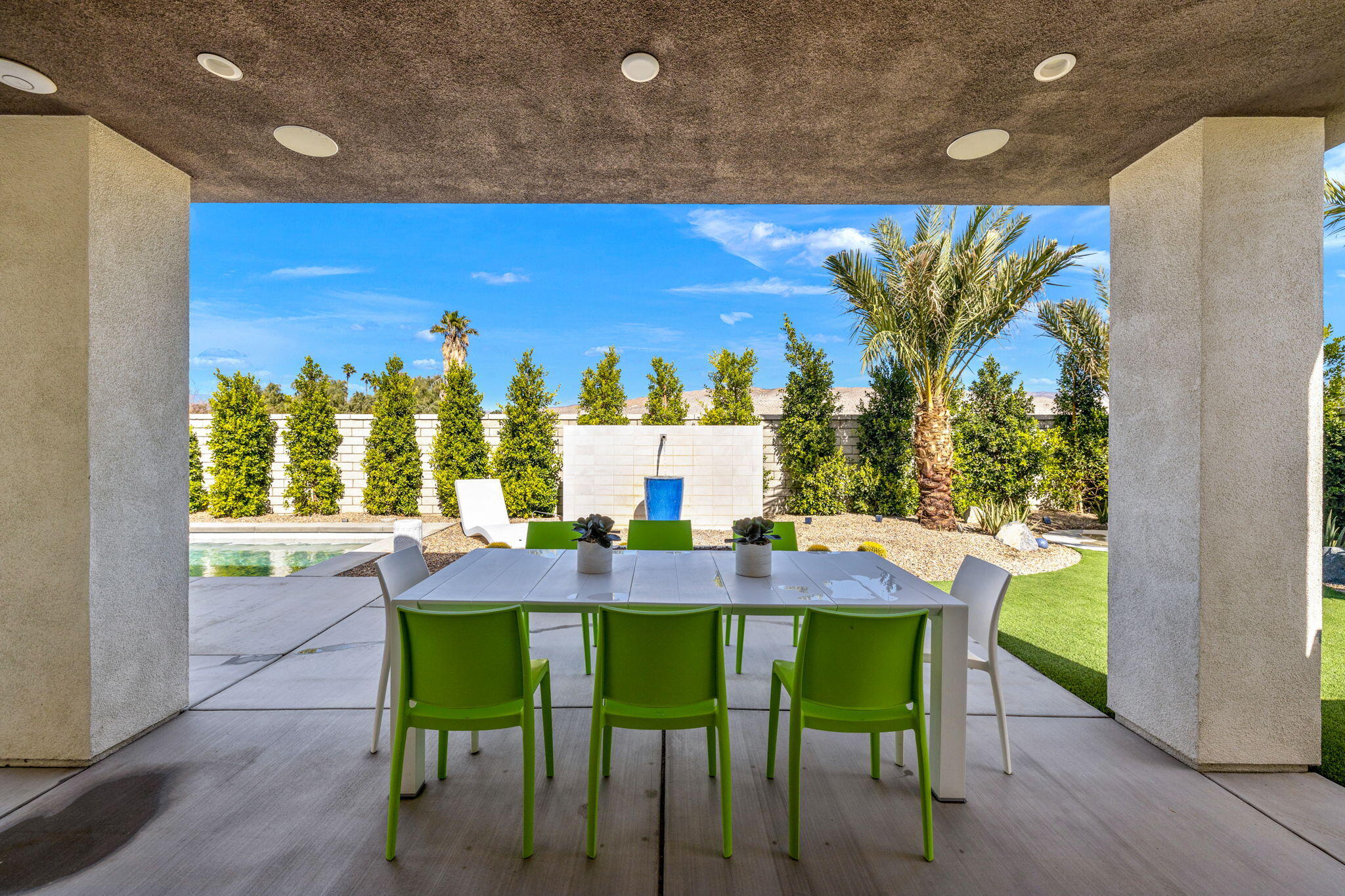2 Iridium Way Rancho Mirage, CA 92270 - Photo 47 of 67 a view of a dining room with furniture and wooden floor