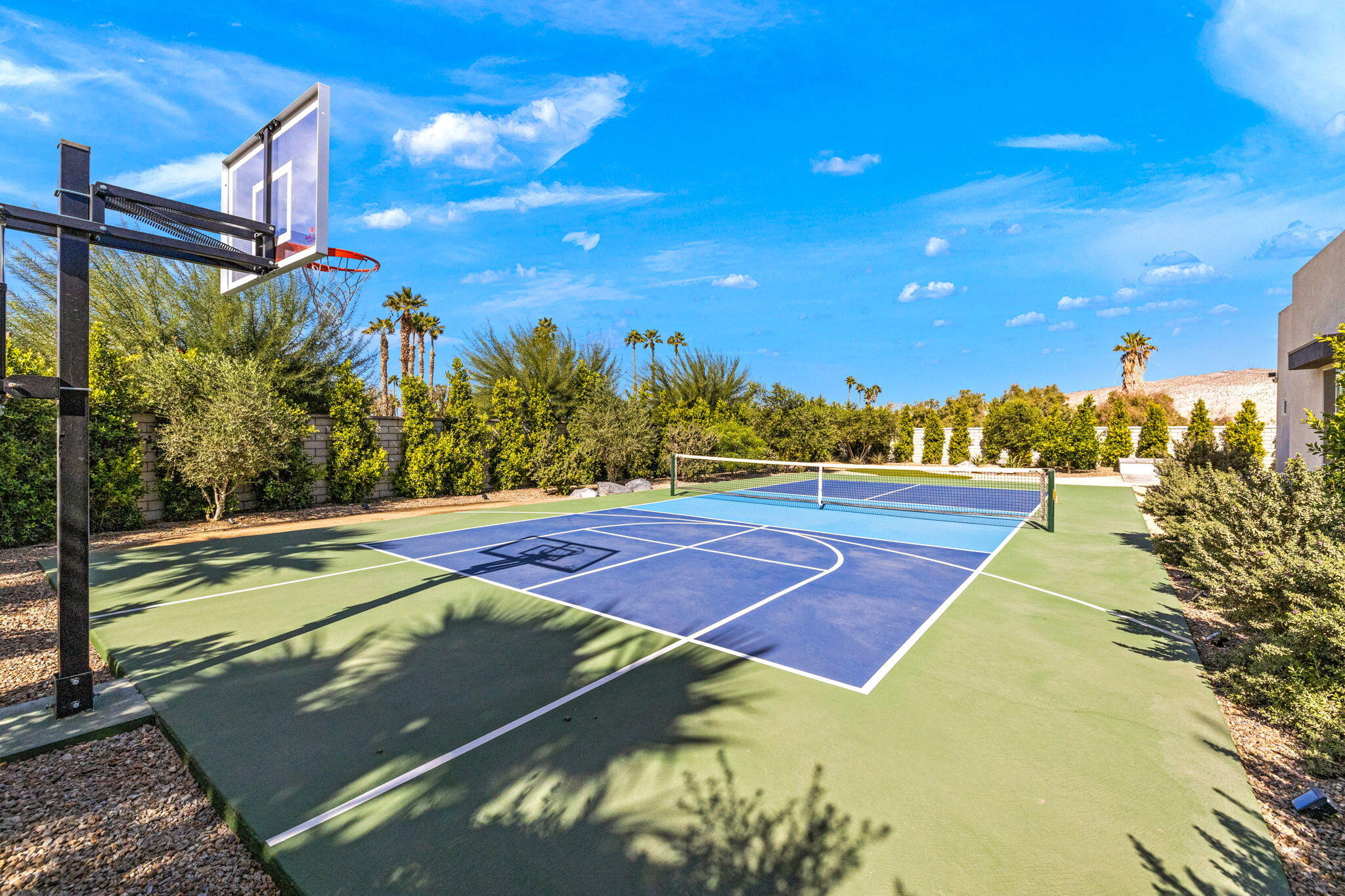 2 Iridium Way Rancho Mirage, CA 92270 - Photo 66 of 67 a view of a tennis ground with large trees