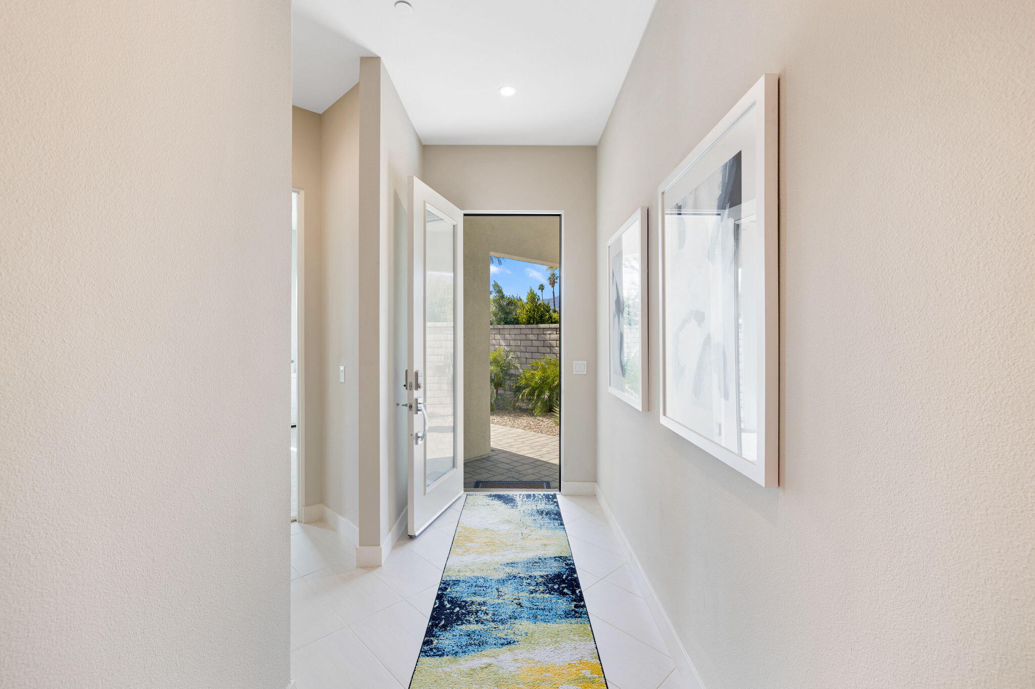 2 Iridium Way Rancho Mirage, CA 92270 - Photo 7 of 67 a view of a hallway with wooden floor and a window