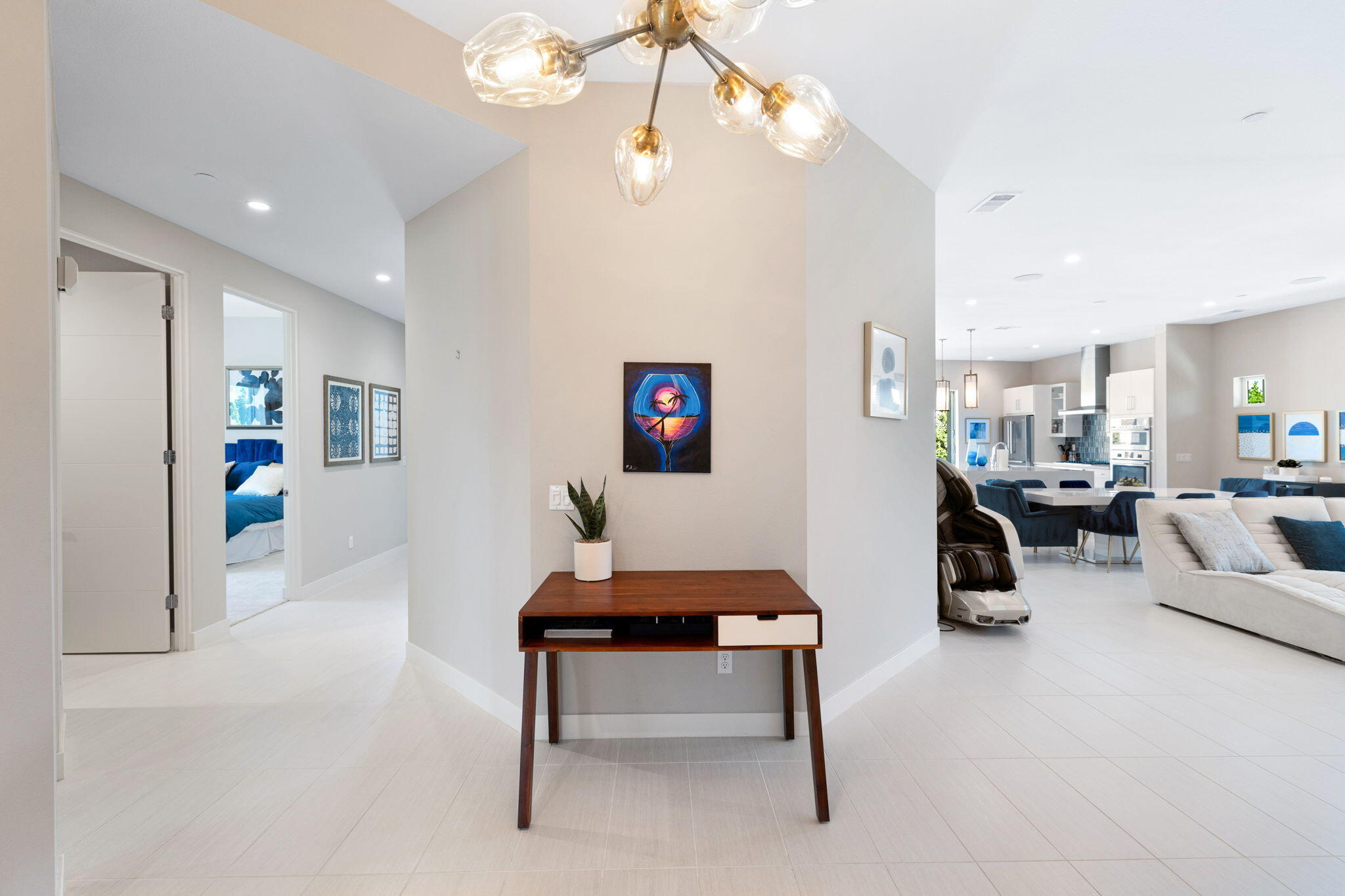 2 Iridium Way Rancho Mirage, CA 92270 - Photo 8 of 67 a living room with furniture and a chandelier