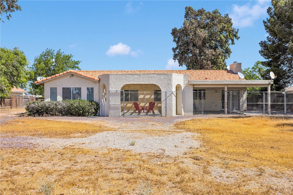 20403 Ochoa Road Apple Valley, CA 92307 - Photo 6 of 48 a front view of house with yard and trees around