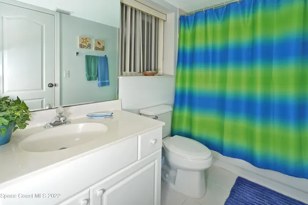 a bathroom with a sink toilet and garden