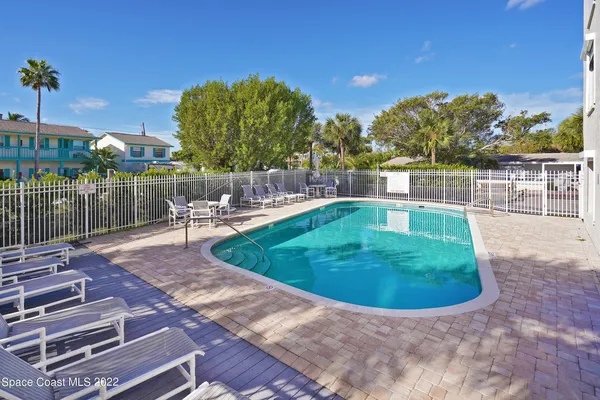 a view of a swimming pool with a patio