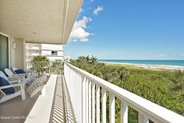 a view of balcony with furniture