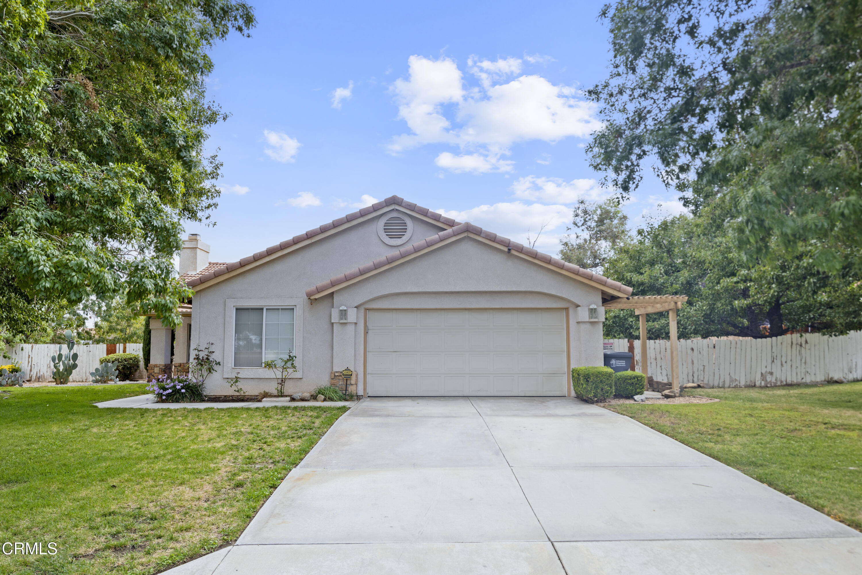 15589 Cheyenne Street Hesperia, CA 92345 - Photo 1 of 12 a front view of house with yard and green space