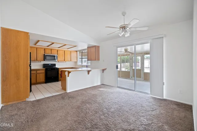 a view of a kitchen with a stove cabinets and a kitchen
