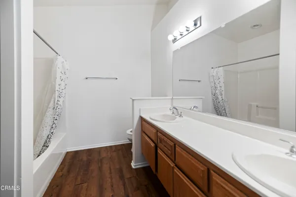 a room with a sink and a mirror