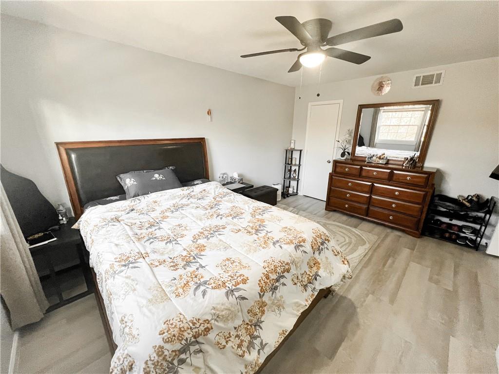 3549 Old Chamblee Tucker Road, Unit J Atlanta, GA 30340 - Photo 13 of 61 a bedroom with a bed and a chandelier