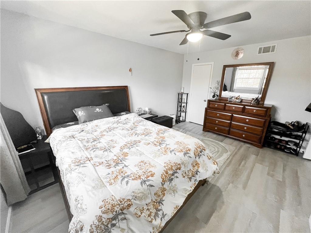 3549 Old Chamblee Tucker Road, Unit J Atlanta, GA 30340 - Photo 15 of 61 a bedroom with a bed and a chandelier