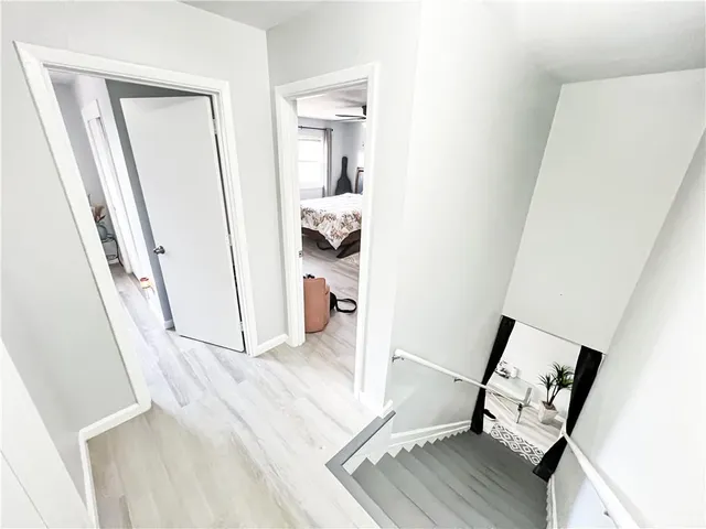 a bathroom with a sink mirror and toilet