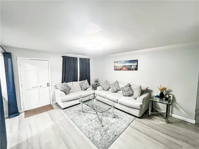 a kitchen with granite countertop a stove and a sink